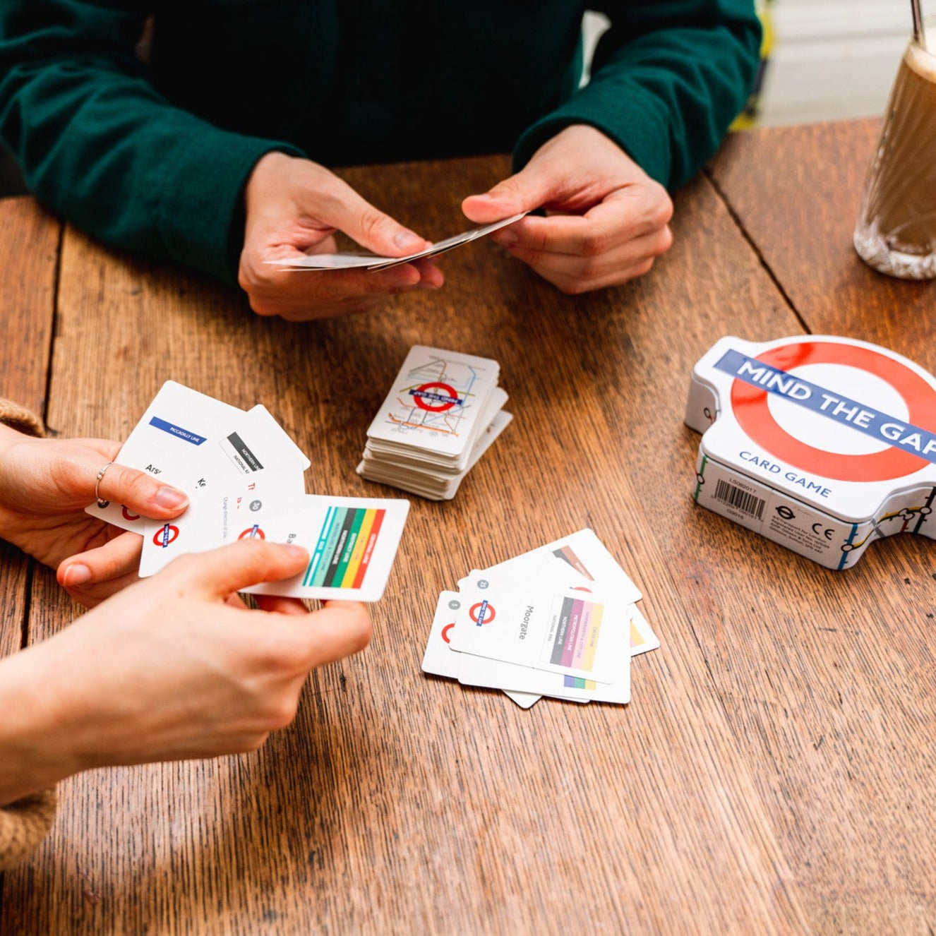 Mind the Gap Gibsons Family TfL Game with content on the table