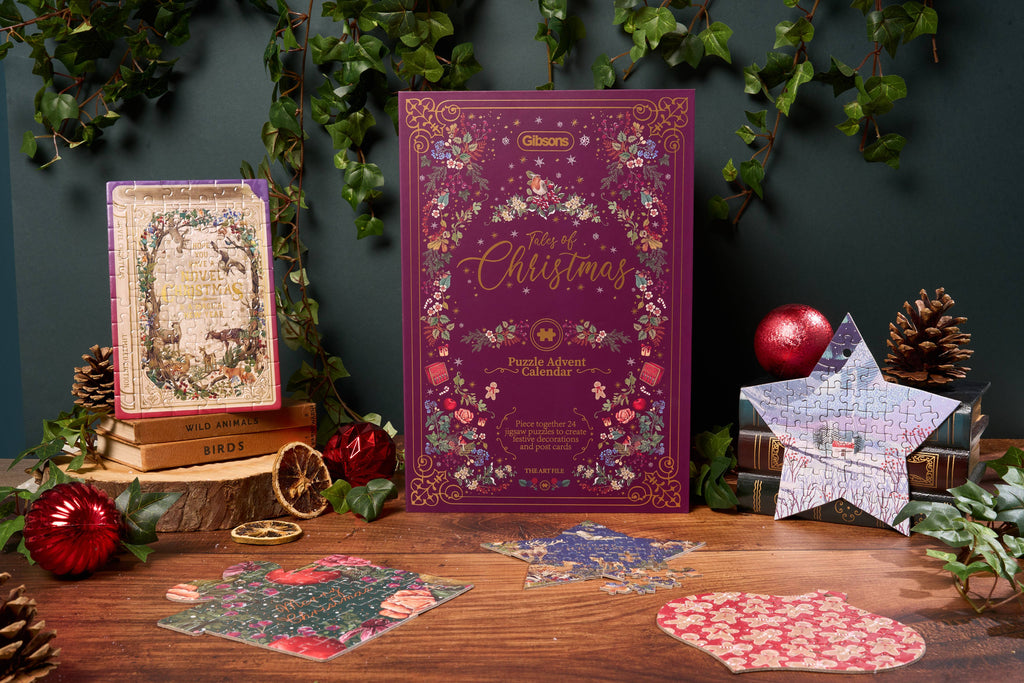 Tales of Christmas Puzzle Advent Calendar 2025 – book-shaped design with gold foiled details