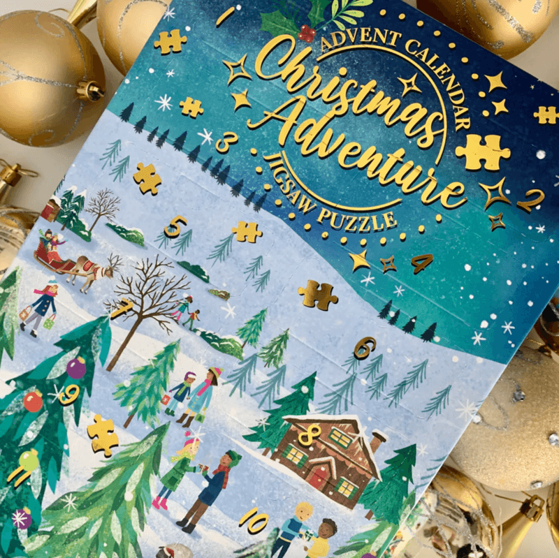 Front of Christmas Adventure jigsaw puzzle advent calendar with baubles around it.