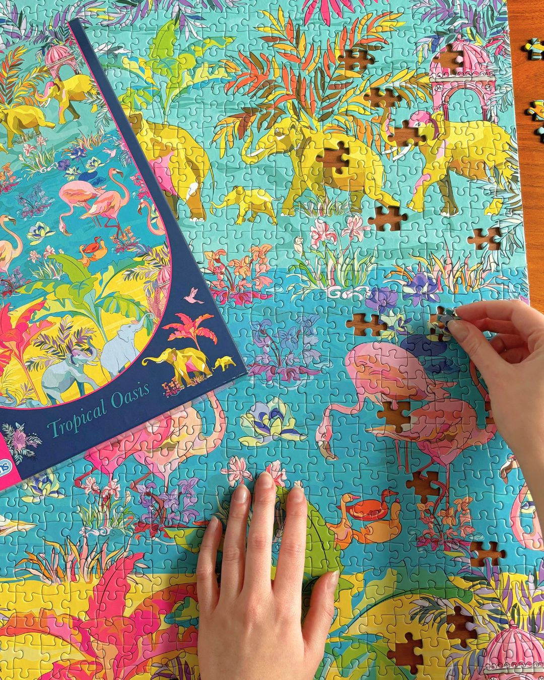 HoT: Tropical Oasis 1000 piece jigsaw puzzle on the table nearly completed