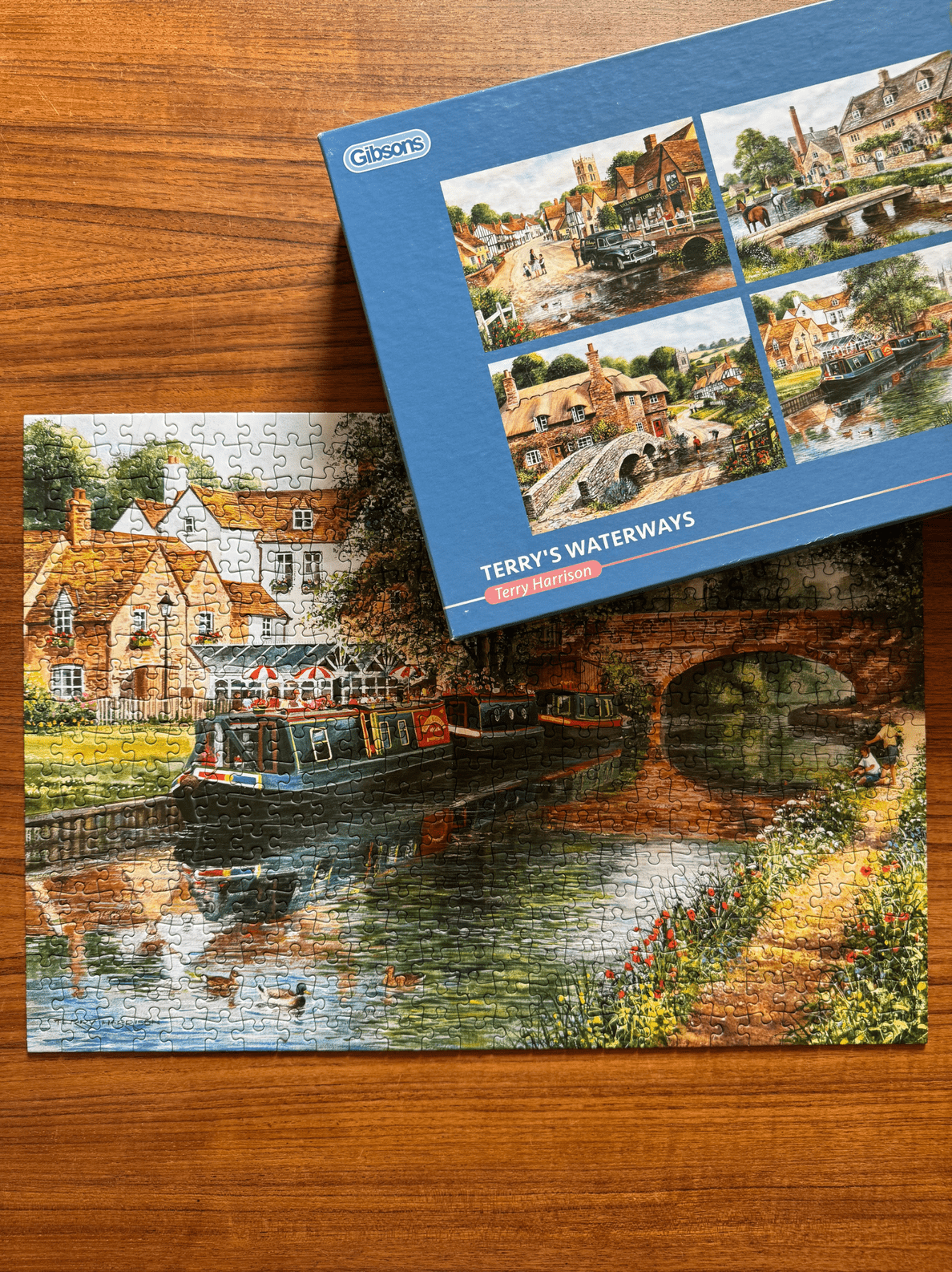 Jigsaw puzzle with 'Terry's Waterways' theme on a wooden surface