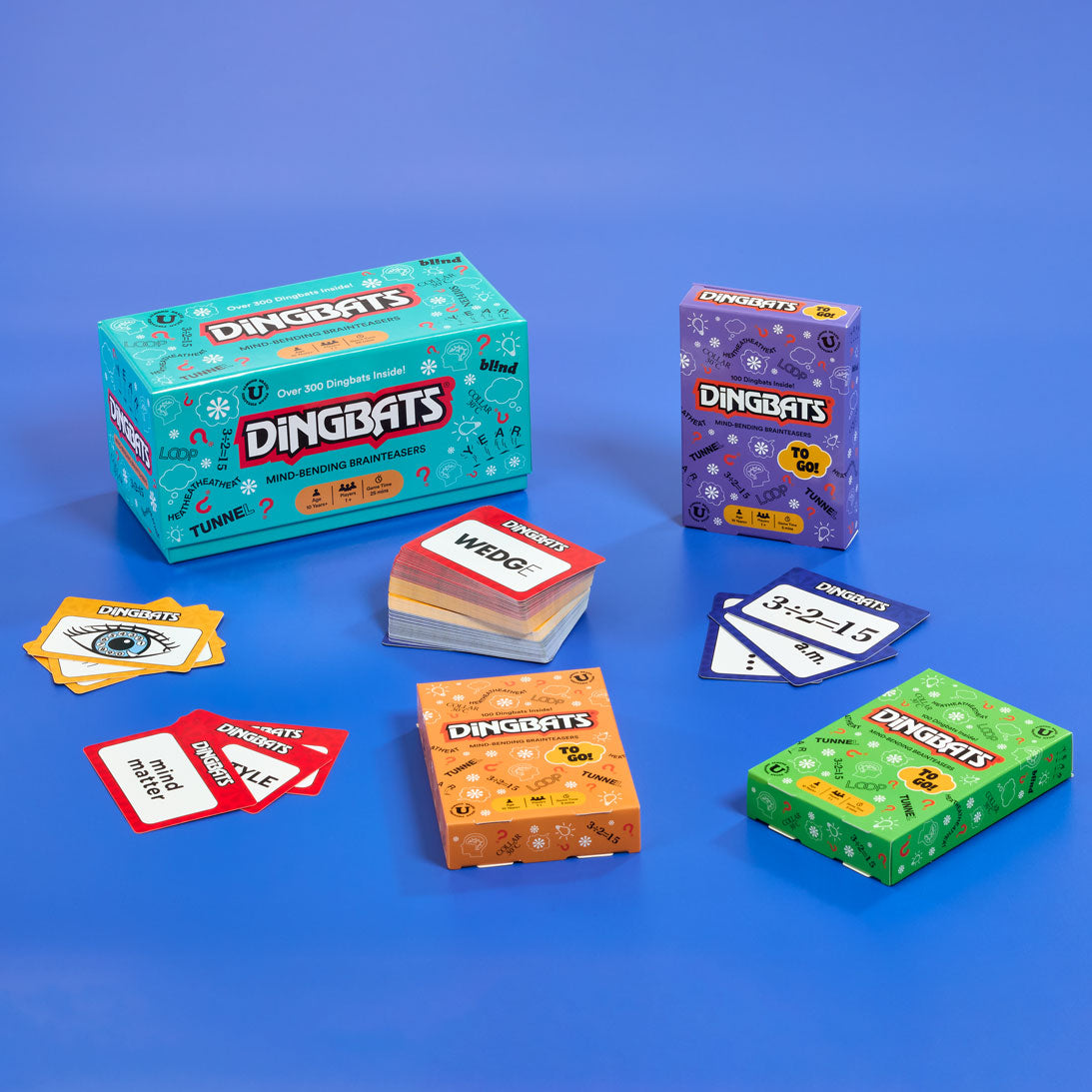 Dingbats card game packaging and cards on a blue background