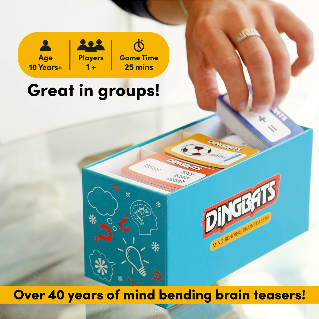 The image shows the board game 'Dingbats' which includes a box and several colourful game cards with different levels
