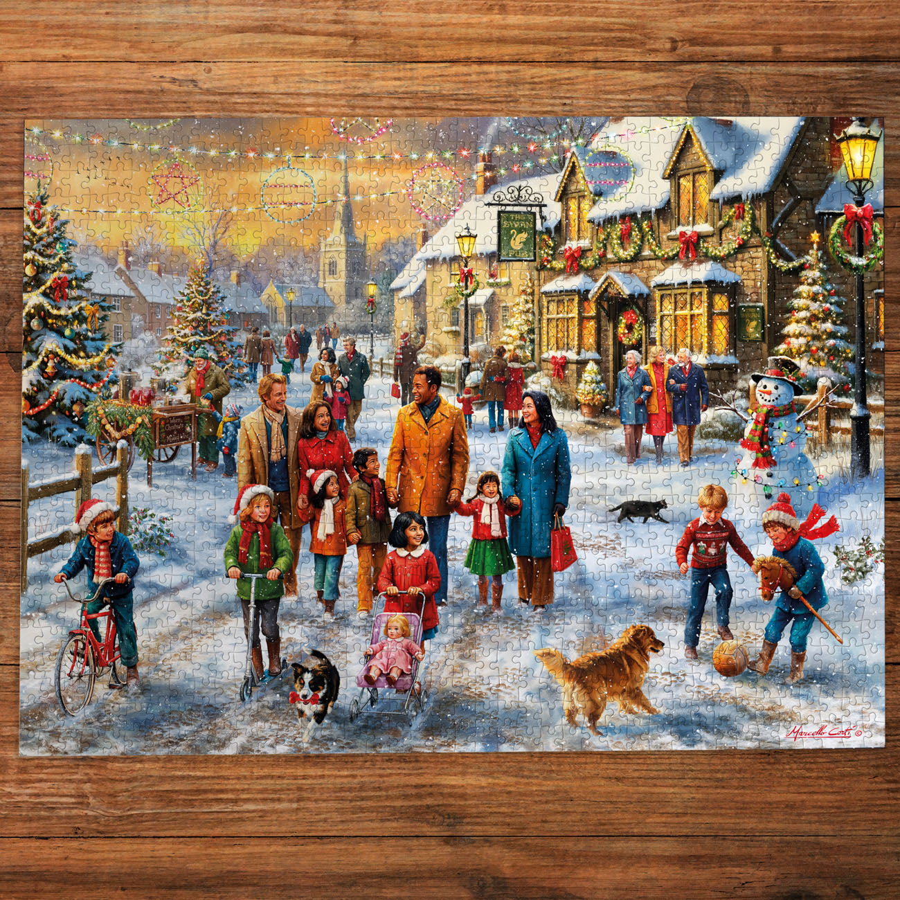 Christmas-themed puzzle with a snowy village scene on a wooden surface