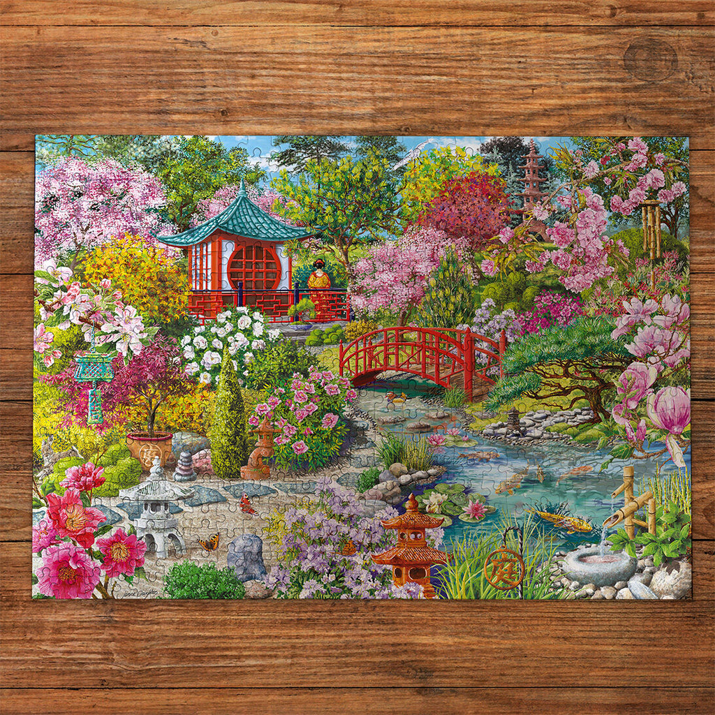 The Japanese Garden Extra Large 100XXL Piece Jigsaw Puzzle by Gibsons made up on wooden table