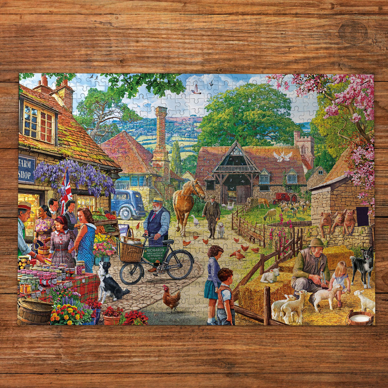 Jigsaw puzzle with a colorful village scene on a wooden surface