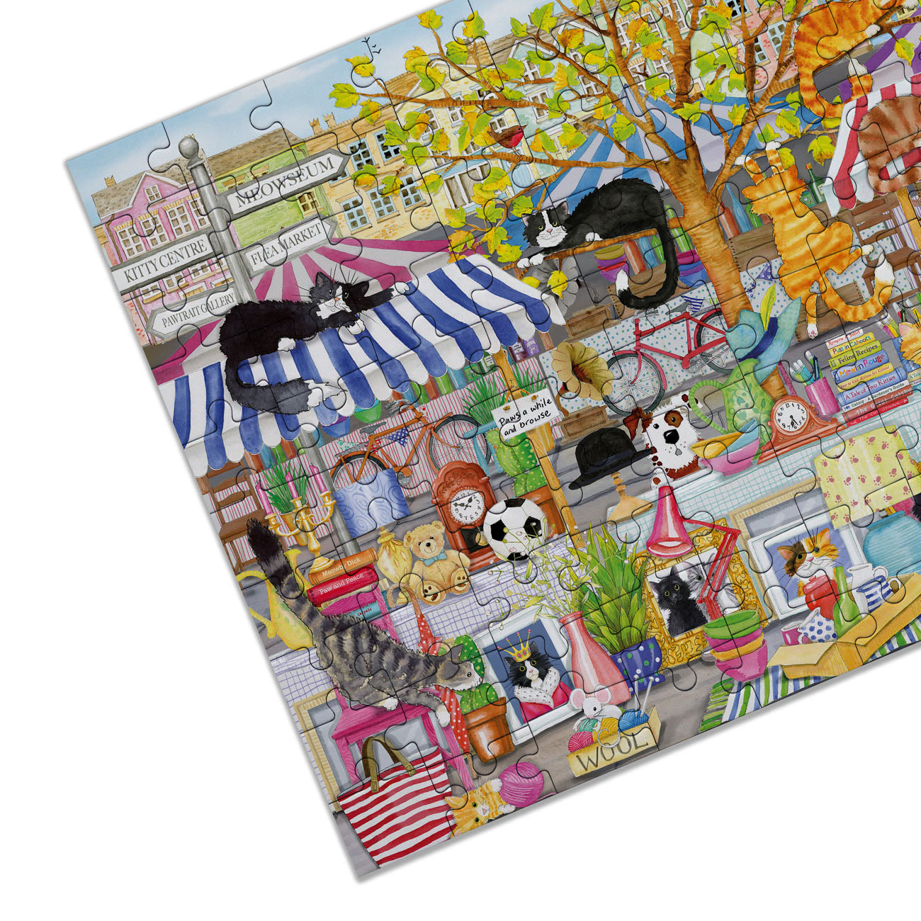 Jigsaw puzzle with a colorful scene of cats in various settings