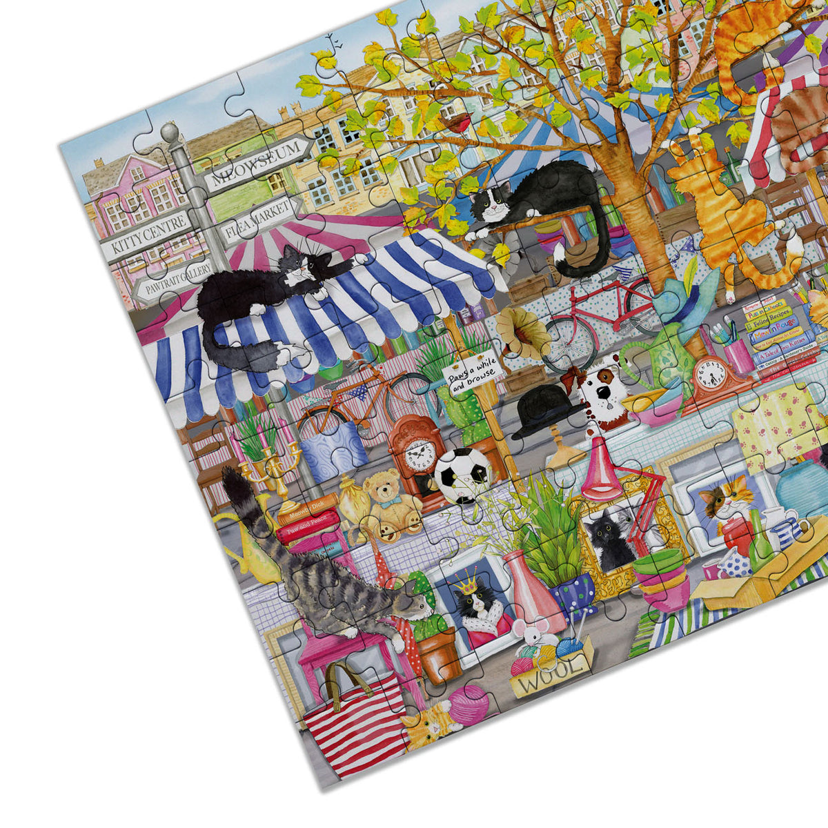 Jigsaw puzzle with a colorful scene of cats in various settings
