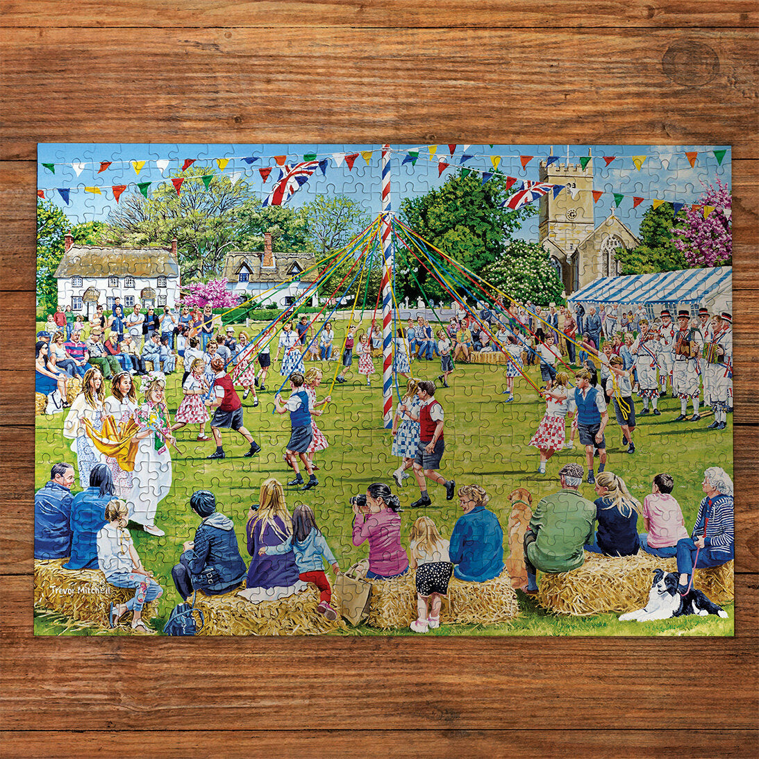 Gibsons Around the Maypole 250 extra large piece jigsaw puzzle made up on wooden table
