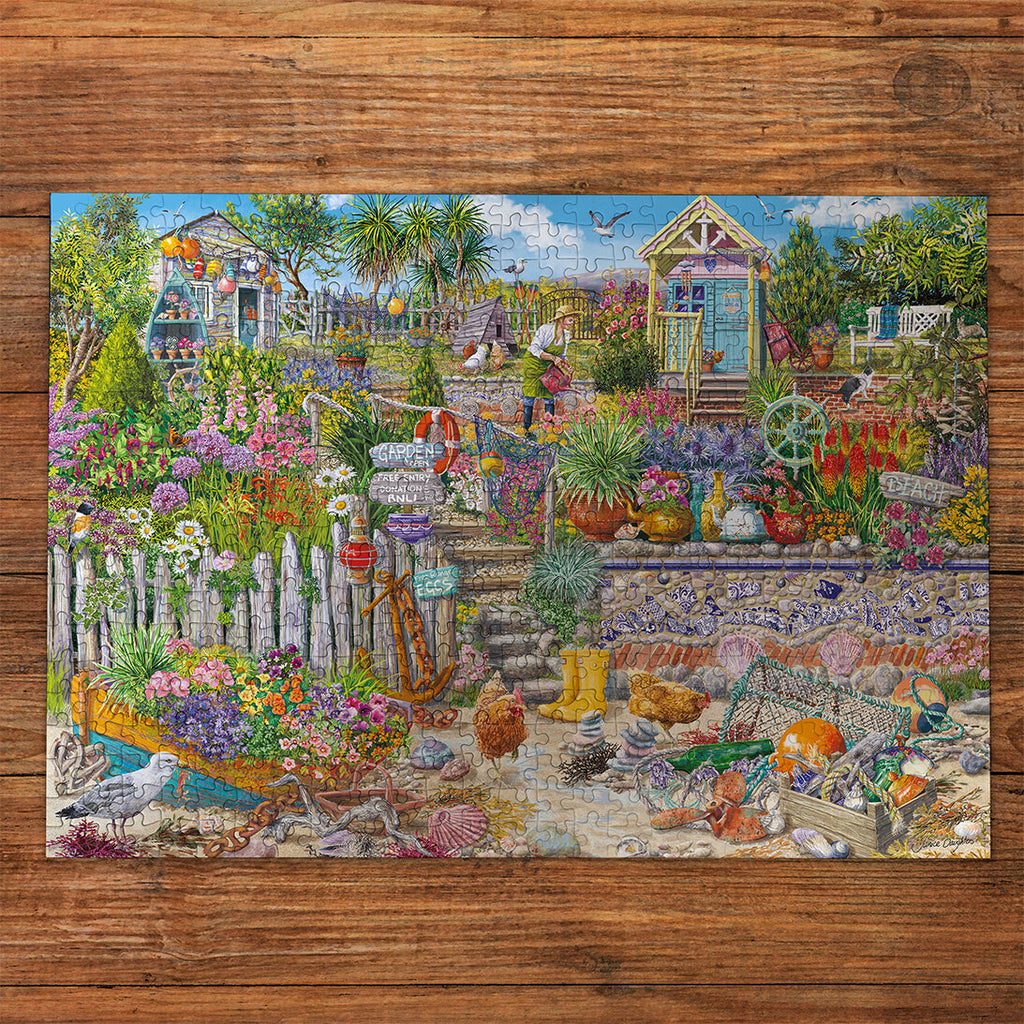Beachcomber's Garden Extra Large 250XL Piece Jigsaw Puzzle made up on wooden table