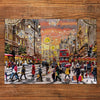 Gibsons Holiday Hustle 250 XL extra large piece jigsaw puzzle made up on wooden table