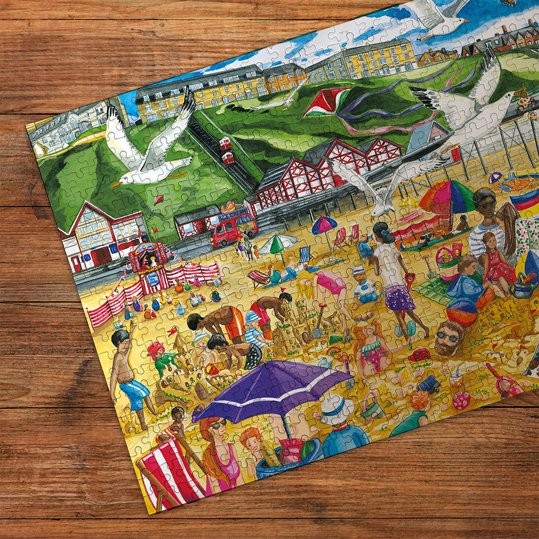 Saltburn-by-the-Sea 500 Piece Jigsaw Puzzle by Gibsons made up detail on wooden table
