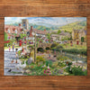 Puddle Ducks & Paddling 500 Piece Jigsaw Puzzle by Gibsons made up on wooden table