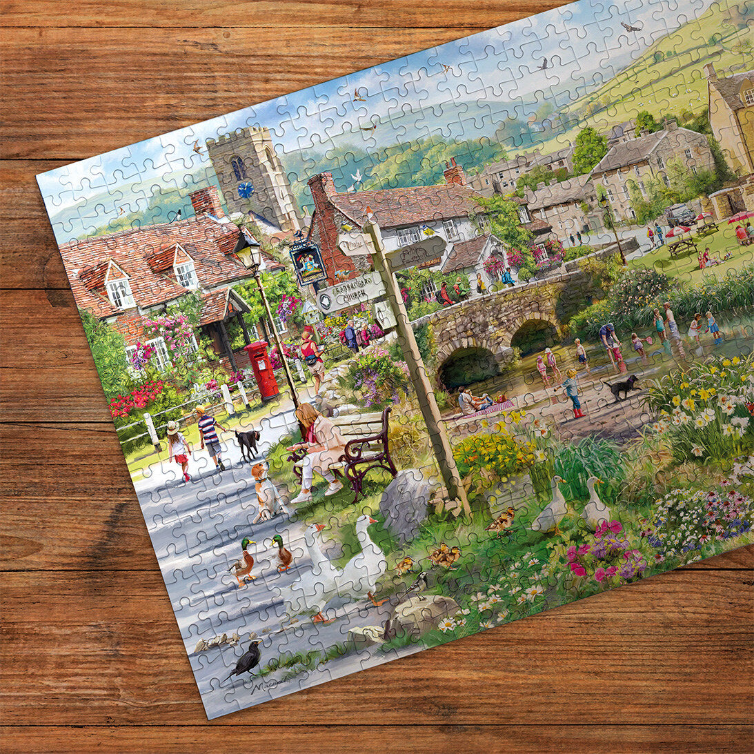 Puddle Ducks & Paddling 500 Piece Jigsaw Puzzle by Gibsons made up detail on wooden table