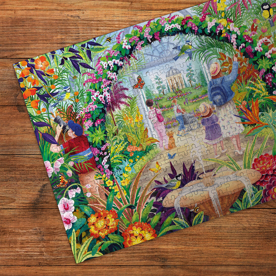 Botanical Blooms 500 Piece Jigsaw Puzzle by Gibson made up detail on wooden table