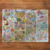 Curious Creatures 500 Piece Jigsaw Puzzle by Gibsons made up on wooden table