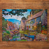 Gibsons Tea on the River 500 Piece Jigsaw Puzzle for Adults made up on wooden background