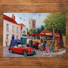 Gibsons Touring the Town 500 Piece Traditional Nostalgic Jigsaw Puzzle for Adults made up on wooden table