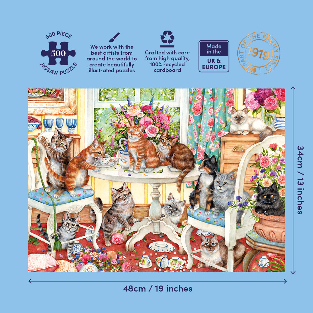 Jigsaw puzzle packaging with cats around a table and decorative elements on a blue background