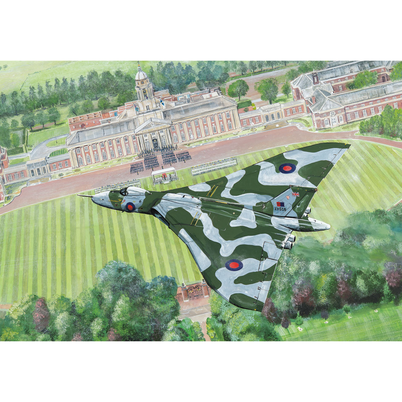 Camouflage airplane flying over a scenic landscape with buildings and greenery.