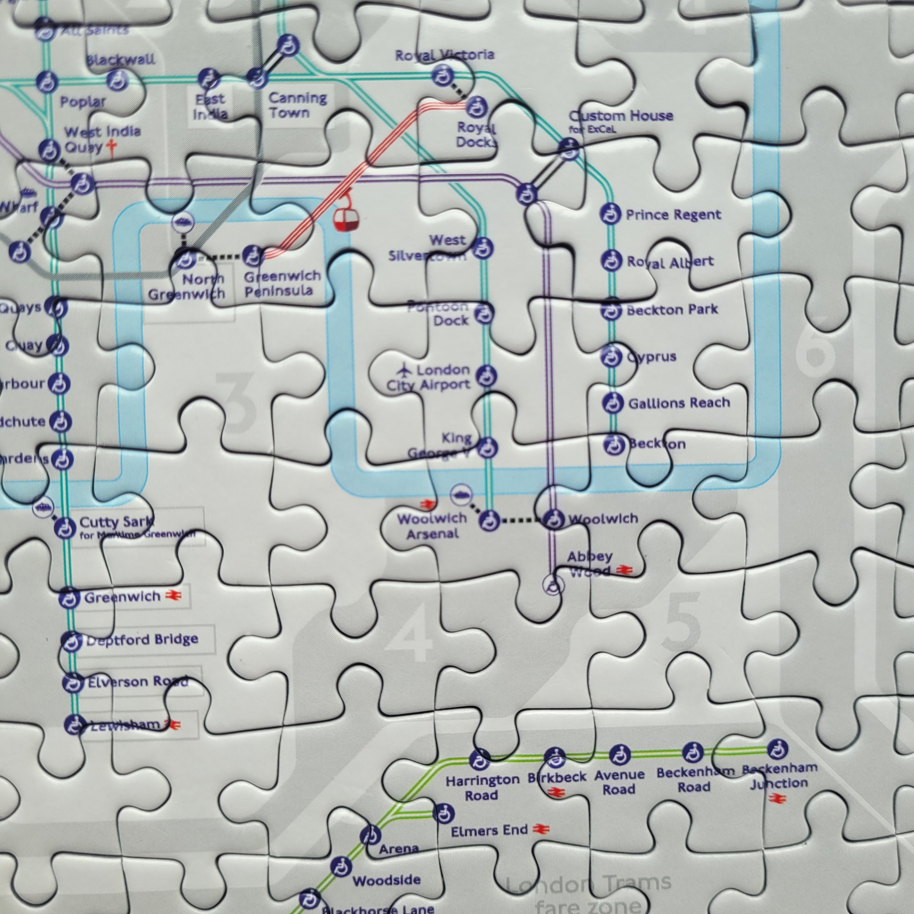 Jigsaw puzzle with a map of London's underground system on a white background