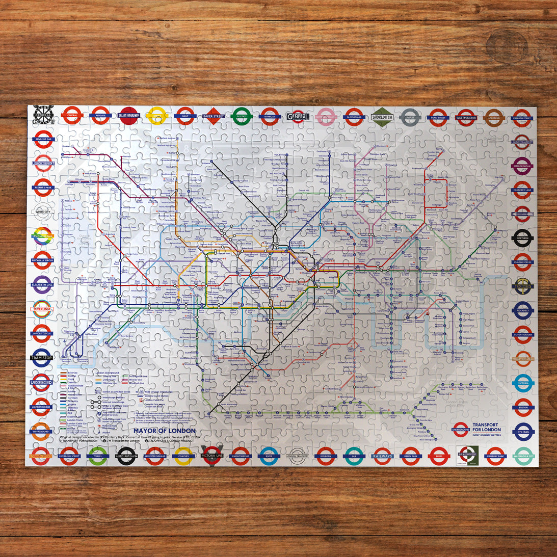 Jigsaw puzzle with a London Underground map on a wooden surface