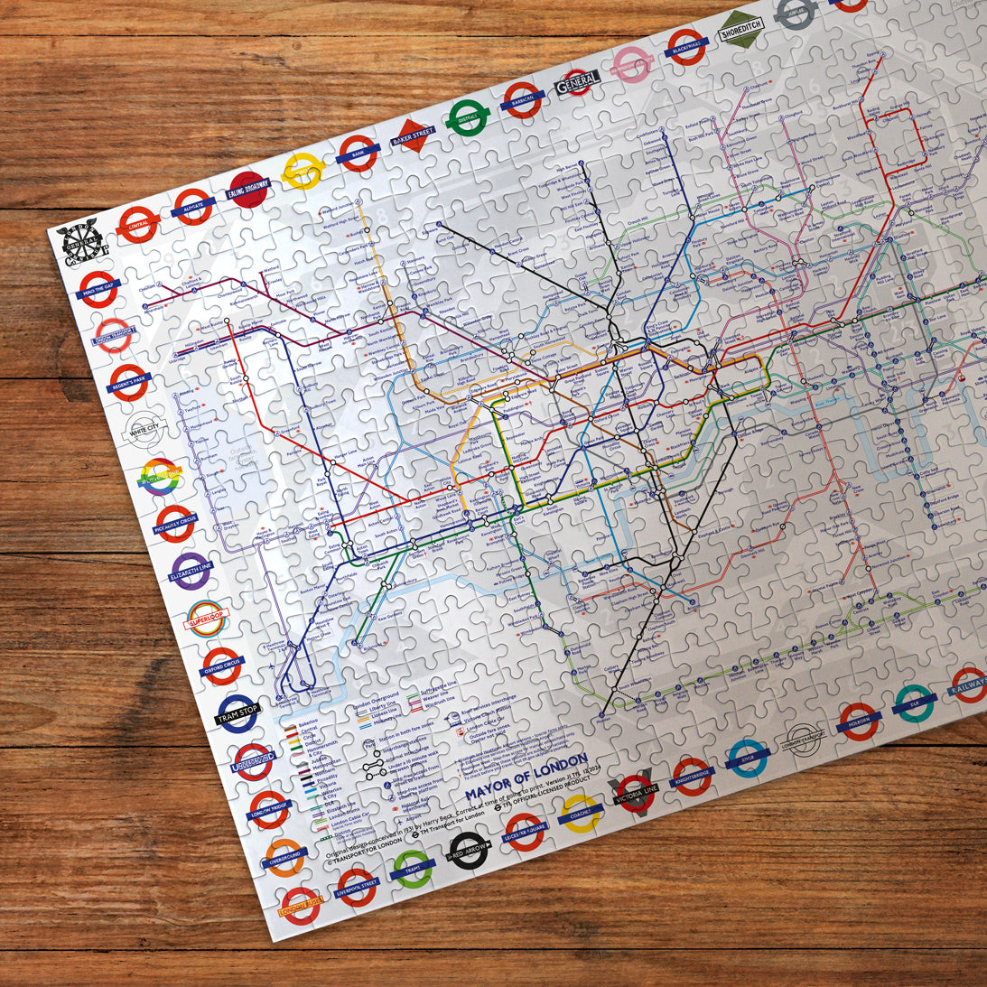 Jigsaw puzzle with a map design on a wooden surface