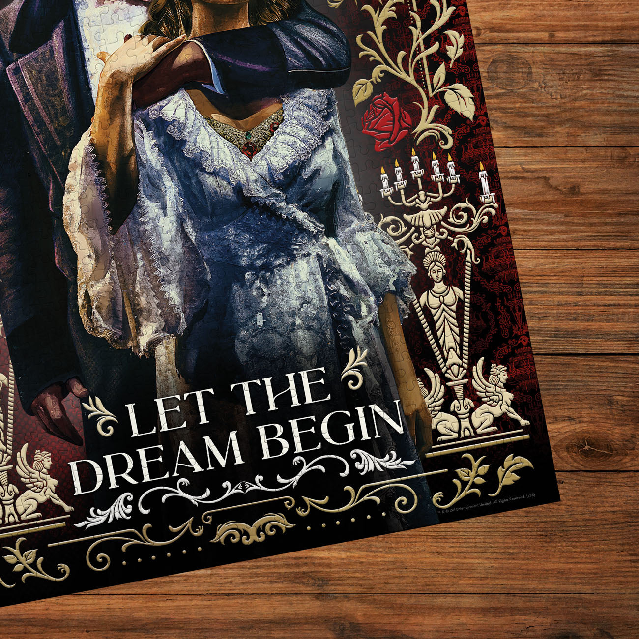 Decorative poster with a woman in a vintage dress and 'Let the Dream Begin' text on a wooden surface.