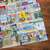Gibsons Bright Lights & Big Cities Extra Large 500 Piece Jigsaw Puzzle made up detail on wooden table