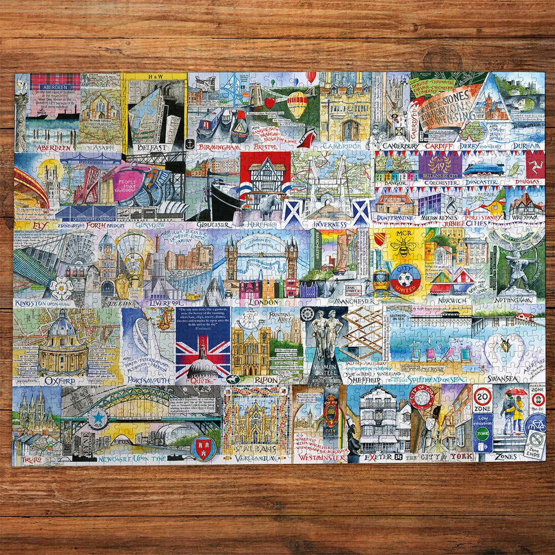 Gibsons Bright Lights & Big Cities Extra Large 500 Piece Jigsaw Puzzle made up on wooden table