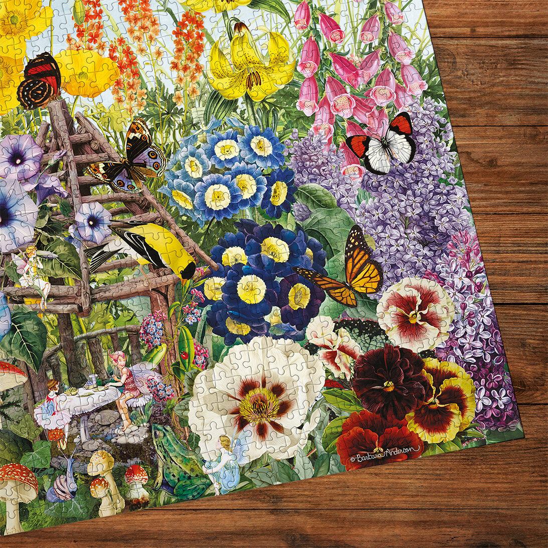 Gibsons Fairy Garden 500 Extra Large Piece jigsaw puzzle made up detail on wooden table