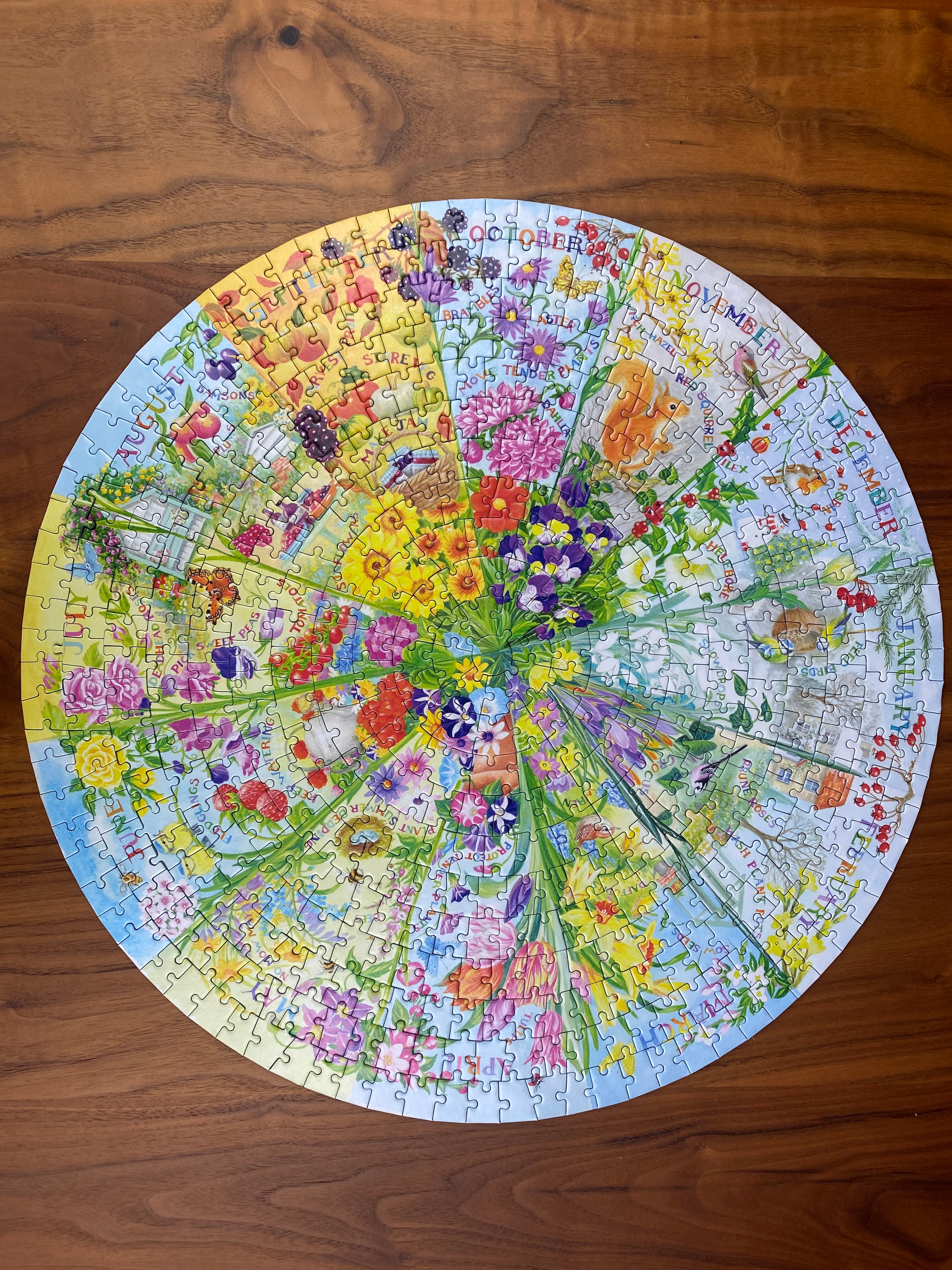 Circular puzzle with floral design on a wooden surface