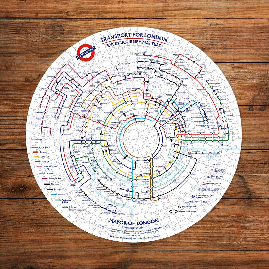 Gibsons TfL Circular Underground Map 500 Circular Piece Fun Jigsaw Puzzle for Adults made up on wooden table