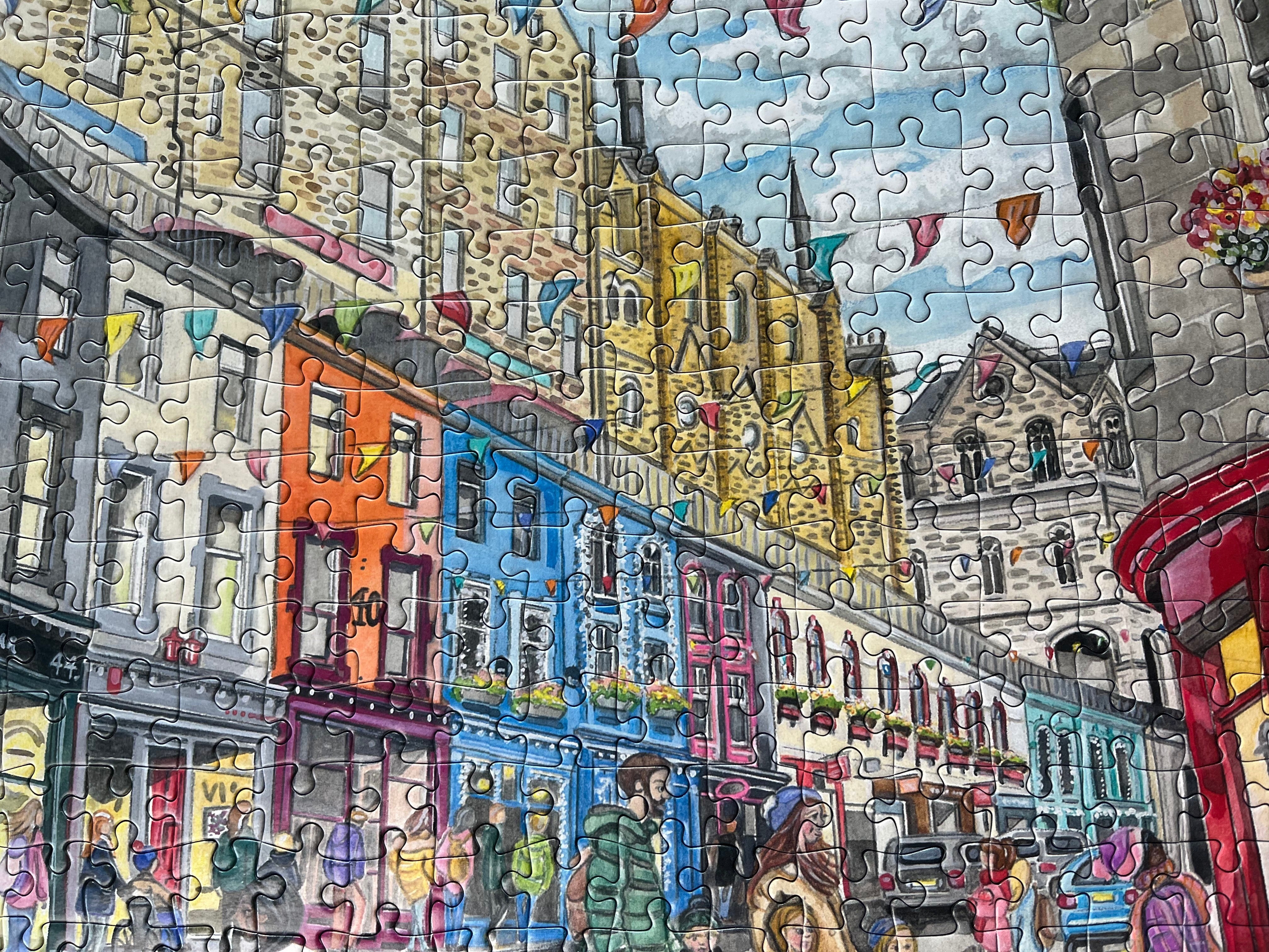 Colorful puzzle of a street scene with buildings and people