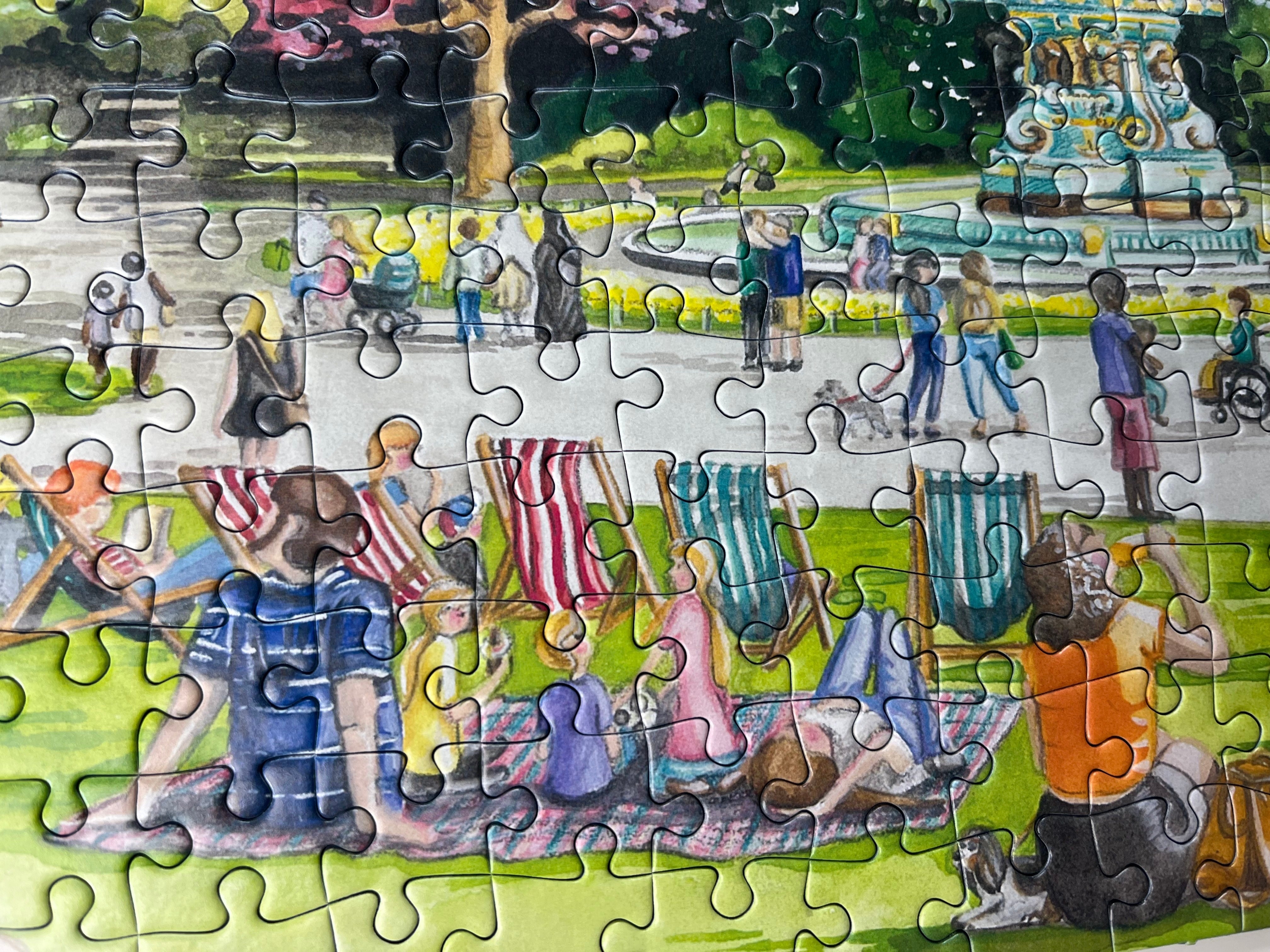 Partial puzzle of a park scene with people and animals.