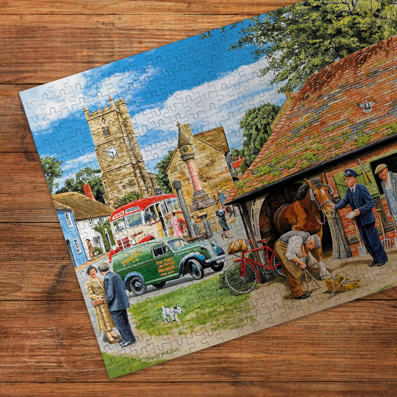 Jigsaw puzzle with a completed scene of a village street on a wooden surface