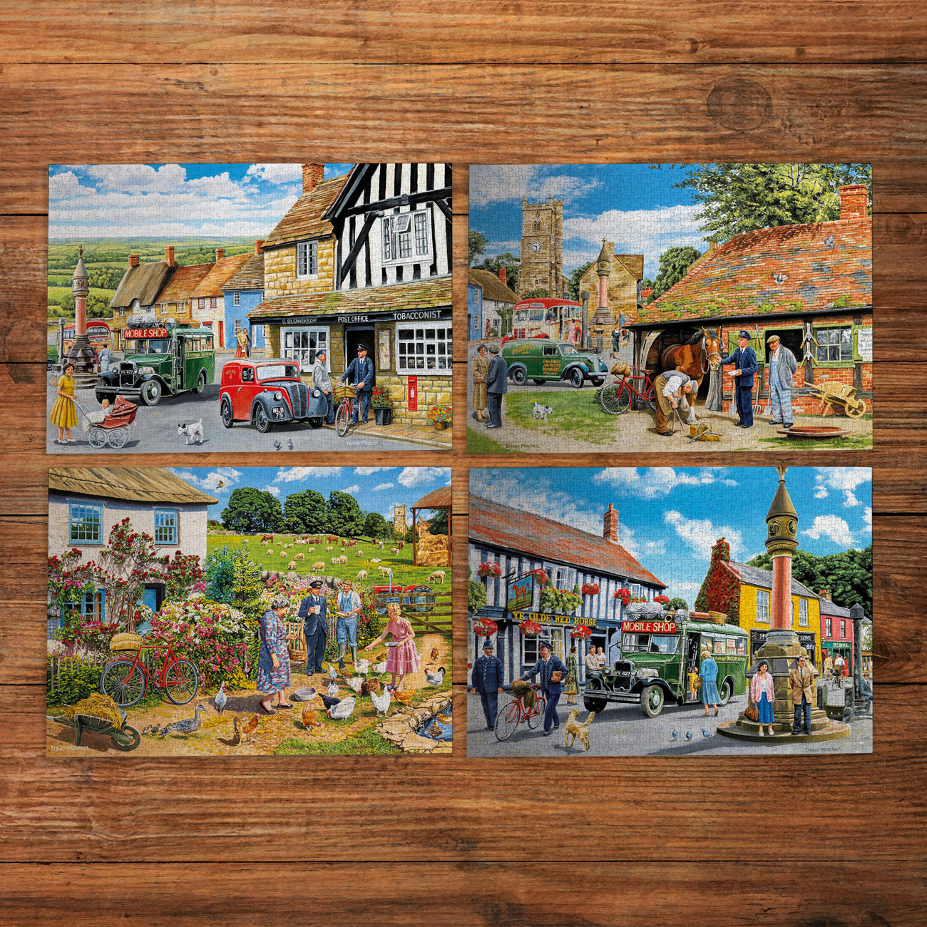 Set of four vintage-style village scenes on a wooden surface