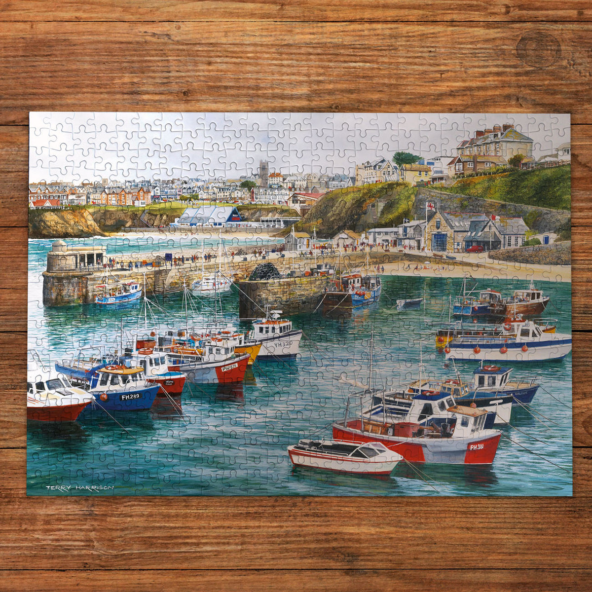 Jigsaw puzzle with a harbor scene on a wooden surface