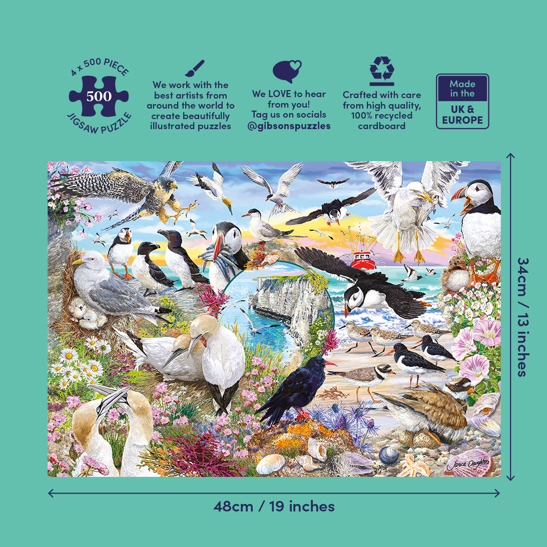 A 500-piece jigsaw puzzle box featuring a colourful illustrated scene of various seabirds, puffins, crows, and seagulls around a lighthouse on a beach. The box is shown on a teal background with dimensions labeled 48cm by 34cm (19 inches by 13 inches) and product feature icons and text at the top.