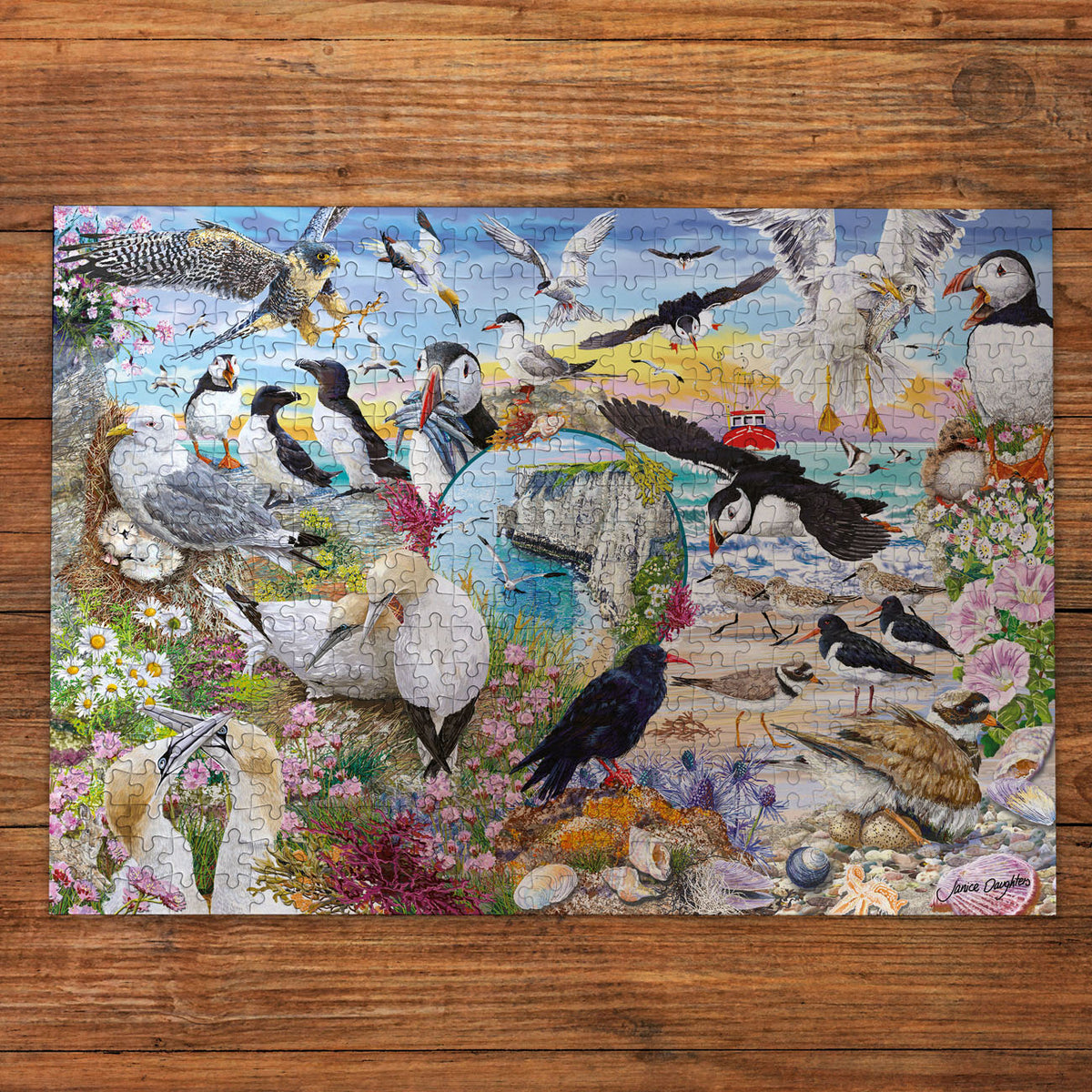 Jigsaw puzzle with a colourful design of various birds on a wooden surface