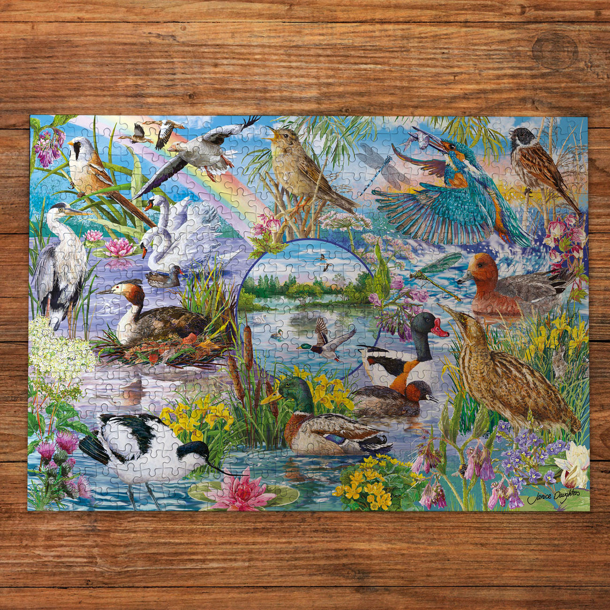 Colourful puzzle with various birds and nature elements on a wooden surface