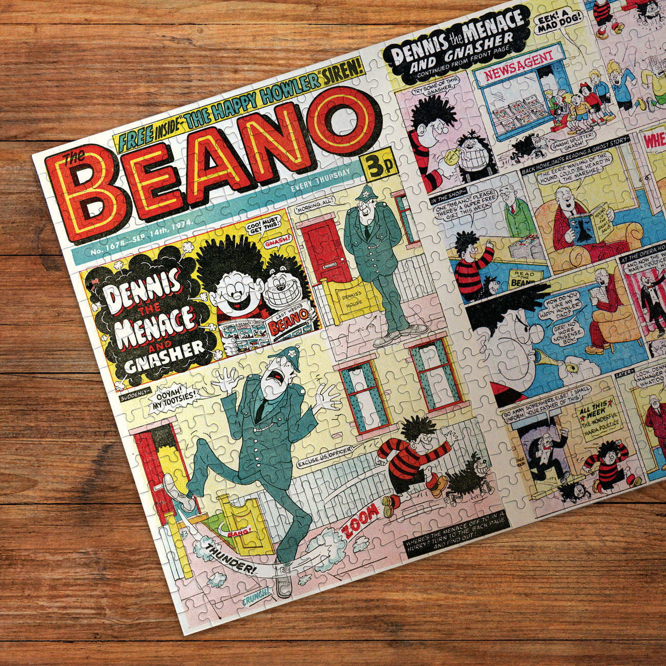 Comic book cover of 'The Beano' featuring Dennis the Menace and Gnasher on a wooden surface.