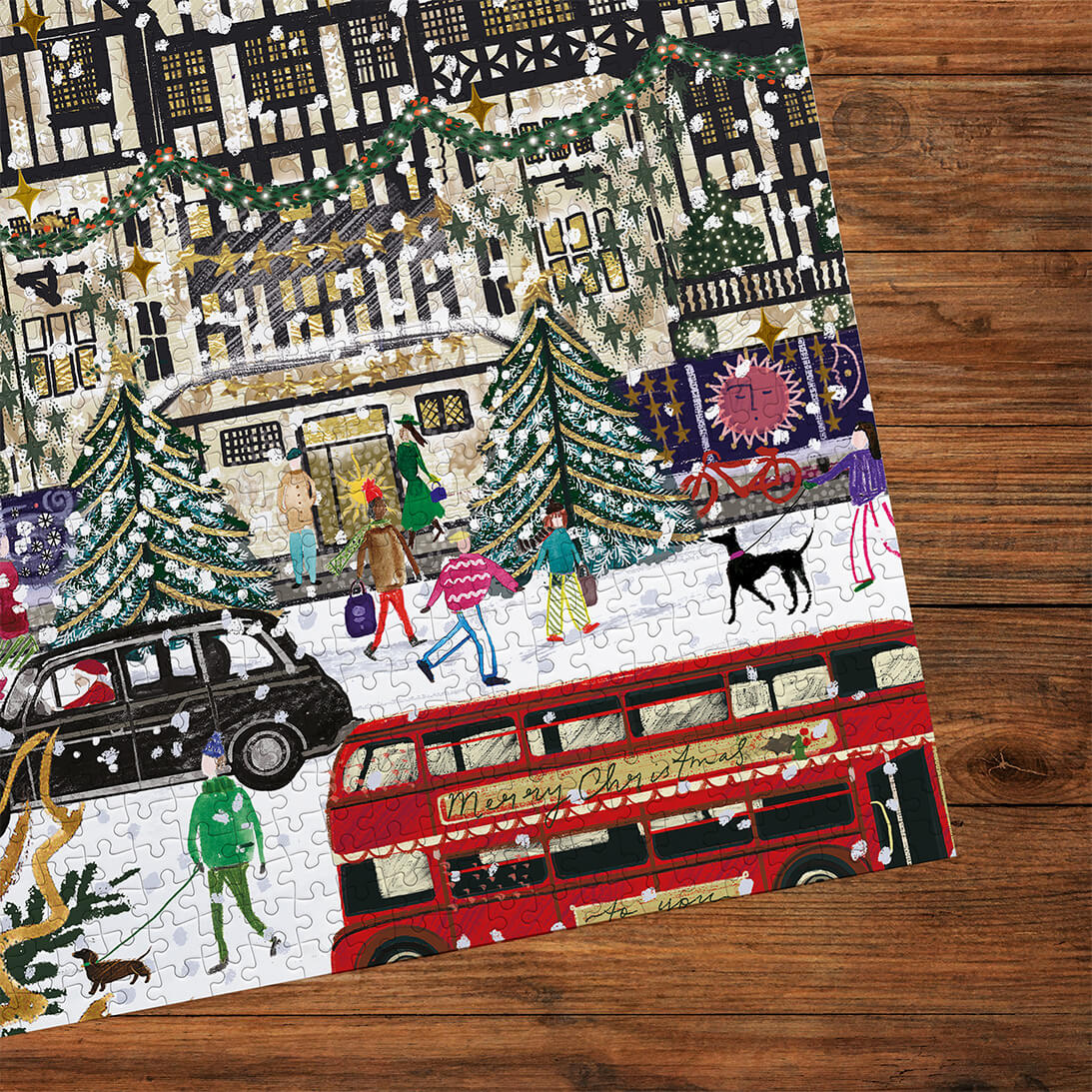 Gibsons Christmas in London 3x500 Gift Multi-box Shoppers in the Snow made up detail on wooden table