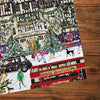 Gibsons Christmas in London 3x500 Gift Multi-box Shoppers in the Snow made up detail on wooden table