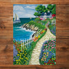 Gibsons Call of the Coast 3x500 Multi-box Gift Set Jigsaw Puzzles, Cliffside Cottage made up on wooden table