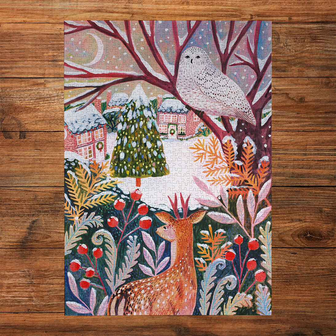 Gibsons Frosty Fauna 3x500 Gift Set Perfect Jigsaw Puzzles made up on wooden table