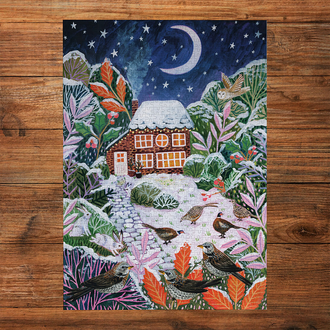 Gibsons Frosty Fauna 3x500 Gift Set Perfect Jigsaw Puzzles made up on wooden table