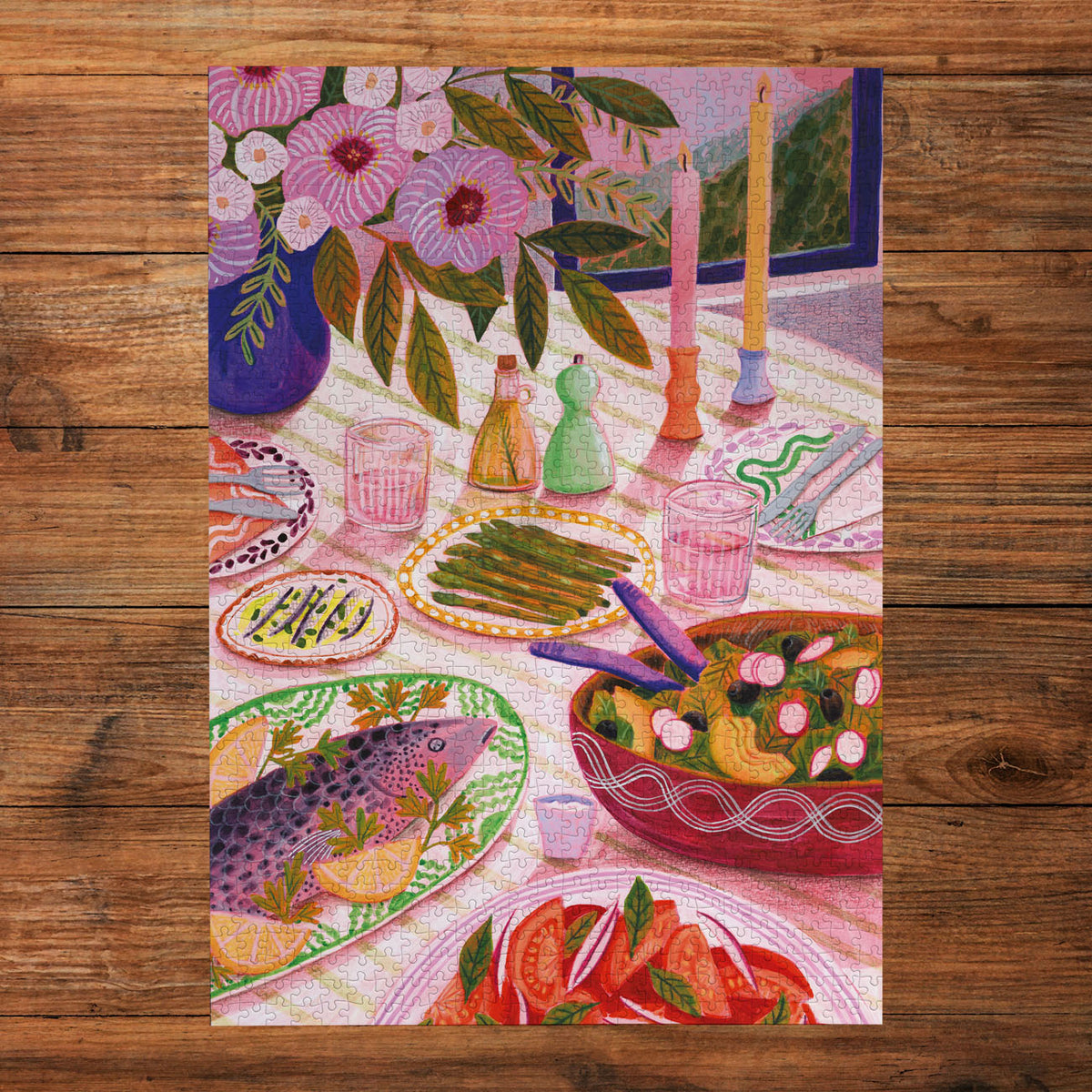 Colourful table scene with food and flowers on a wooden surface