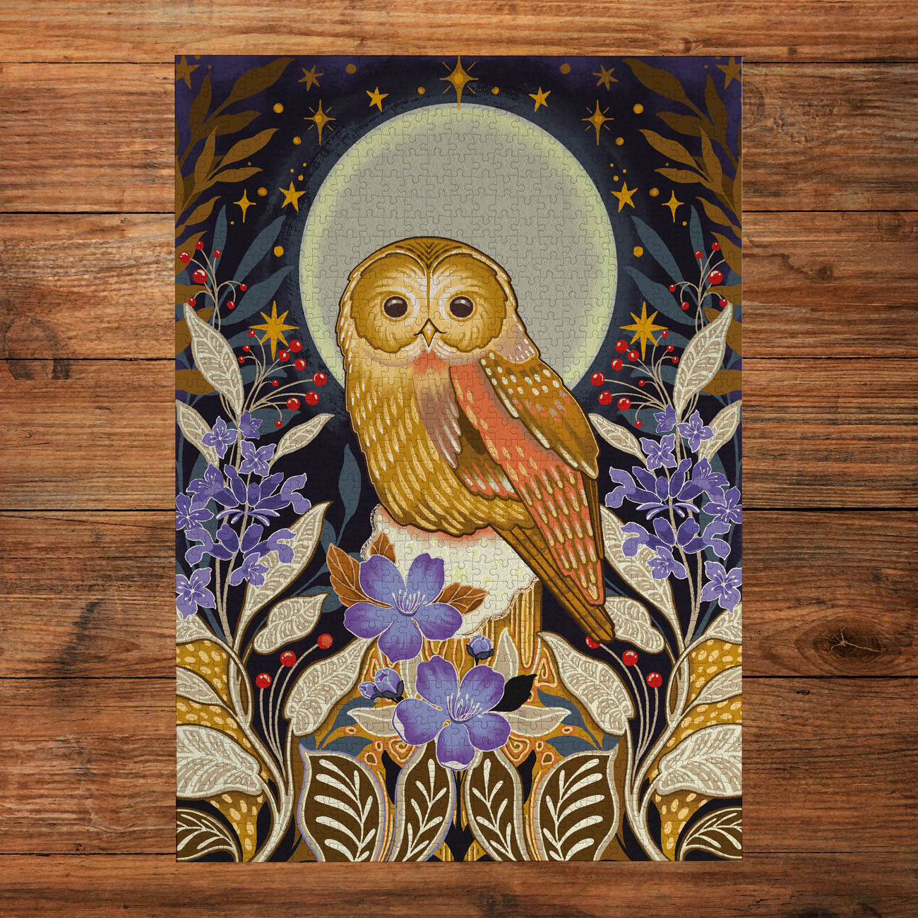 Decorative poster with an owl and floral design on a wooden surface