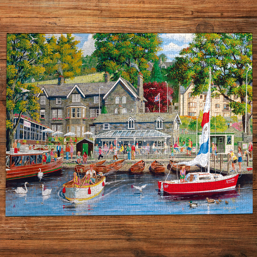Painting of a dock scene with boats and people on a wooden table